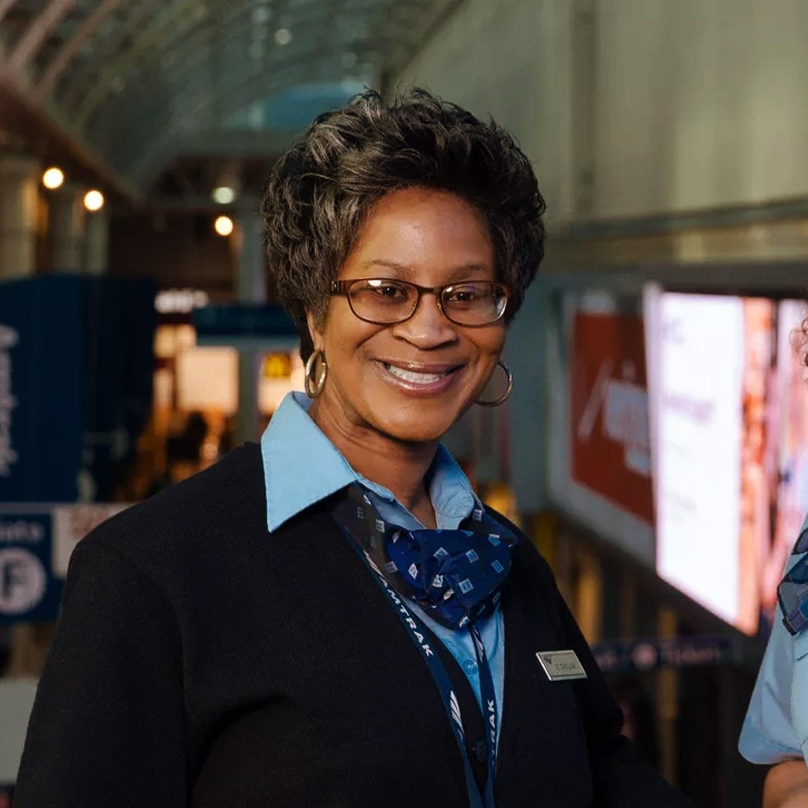 An Amtrak employee smiling