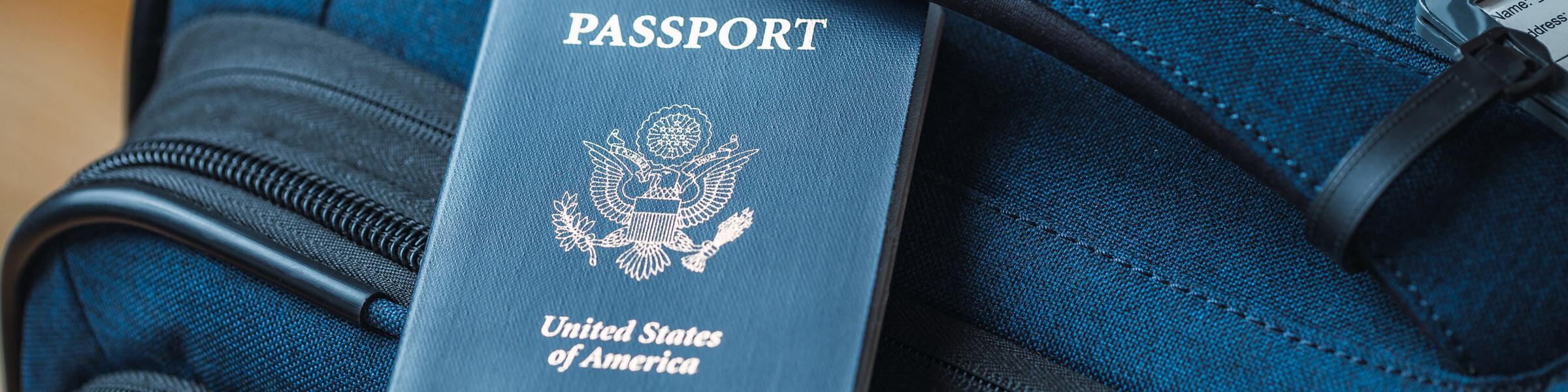 A US passport on a blue bag