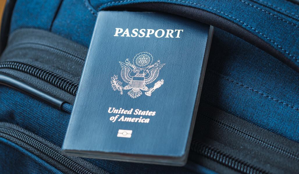 A US passport on a blue bag