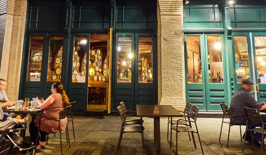 People sititng at a sidewalk cafe