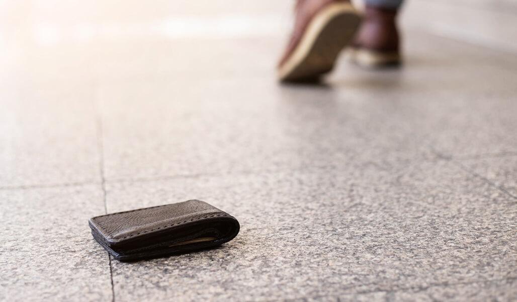 A wallet seemingly abandoned on the floor