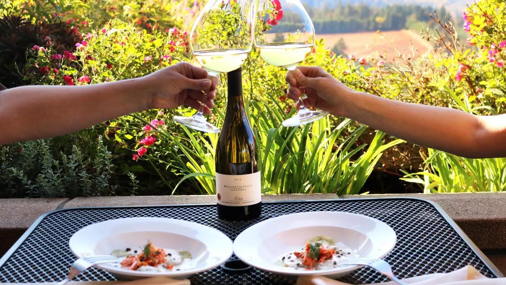 Photo of a table with a couple with wine glasses
